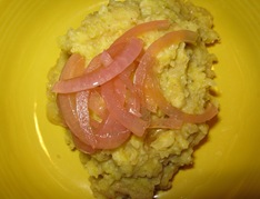 Close-up of mangu with pickled red onions